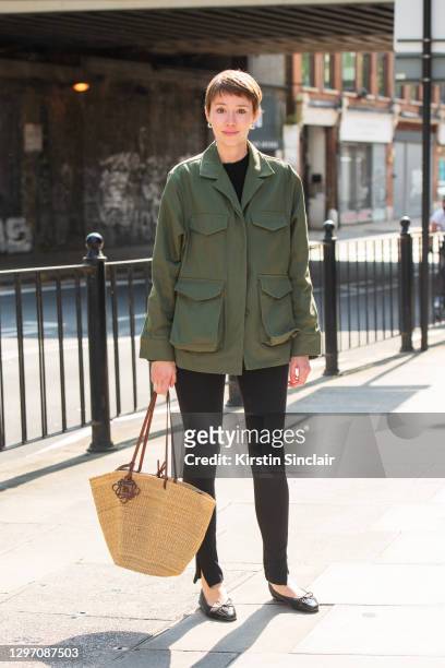 Digital Director at British Vogue Ellie Pithers wears a Loewe bag, Chanel shoes, Toteme jaket and leggings during LFW September 2020 on September 19,...