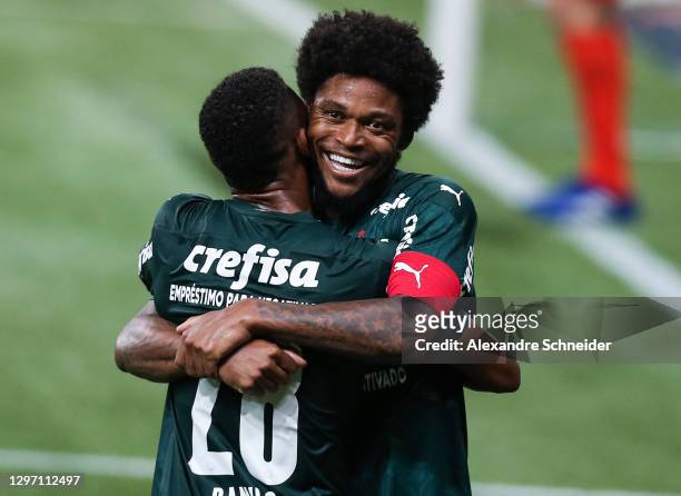 Luiz Adriano of Palmeiras celebrates with his team mate after scoring the fourth goal of their team during the match against Corinthians as part of...