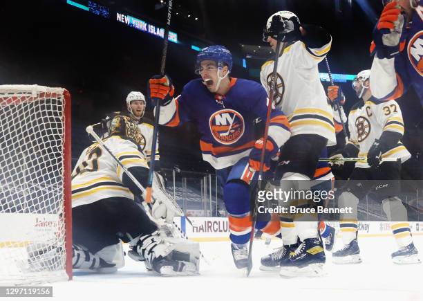 Jean-Gabriel Pageau of the New York Islanders scores at 15:51 of the third period against Tuukka Rask of the Boston Bruins at the Nassau Coliseum on...