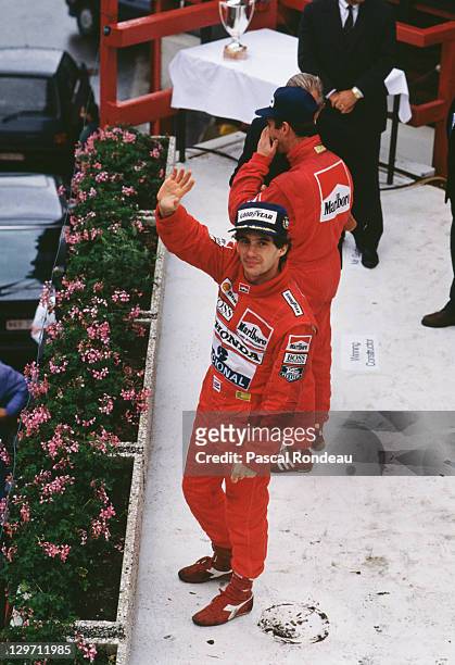Brazilian racing driver Ayrton Senna waves from the podium after winning the Belgian Grand Prix at the Spa circuit, Belgium, 27th August 1989.