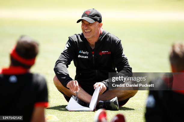 Renegades head coach Michael Klinger speaks to his players during the Melbourne Renegades training session at Junction Oval on January 19, 2021 in...