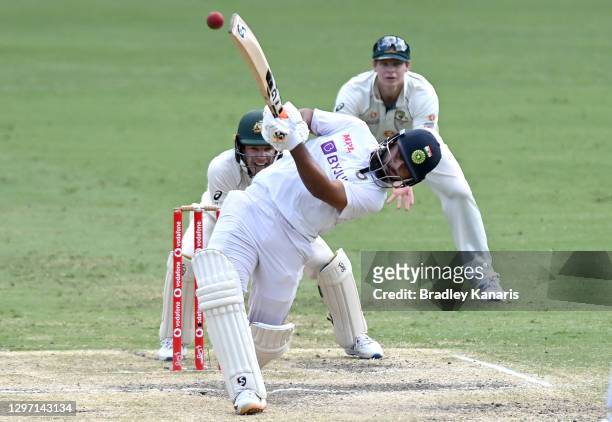 Rishabh Pant of India hits the ball over the boundary for a six during day five of the 4th Test Match in the series between Australia and India at...