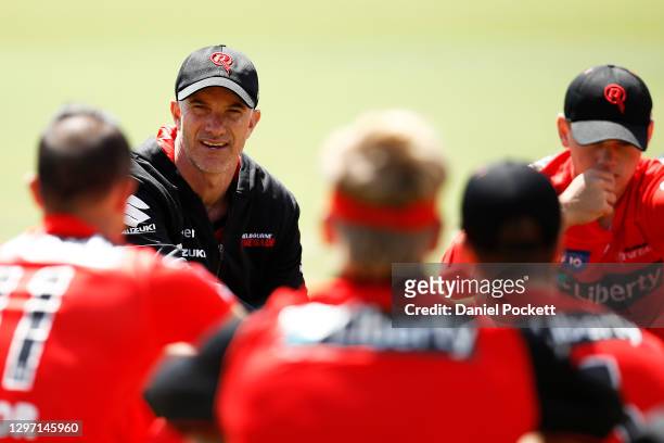 Renegades head coach Michael Klinger speaks to his players during the Melbourne Renegades training session at Junction Oval on January 19, 2021 in...