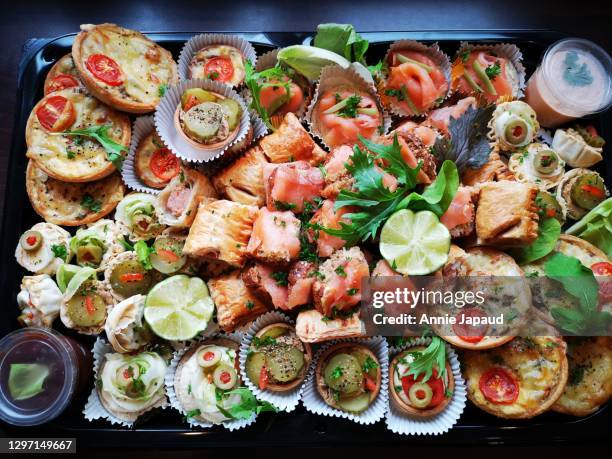 top view of food platter with tasty selection of canapes - mediterranean diet stock pictures, royalty-free photos & images