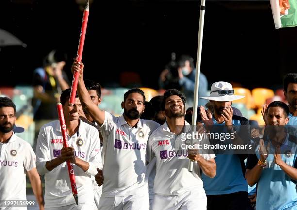 Rishabh Pant of India celebrates victory with his team mates after day five of the 4th Test Match in the series between Australia and India at The...