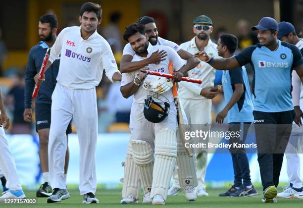 Rishabh Pant of India celebrates victory with his team mates after day five of the 4th Test Match in the series between Australia and India at The...