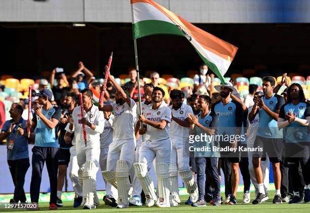 Shardul Thakur of India celebrates victory with his team mates after day five of the 4th Test Match in the series between Australia and India at The...