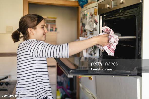 teenager baking in time of stay at home order - baked sweet potato stock pictures, royalty-free photos & images