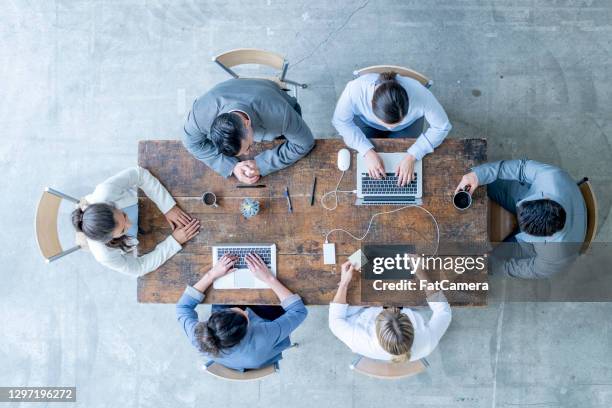 brainstorming our next business strategy - aerial view imagens e fotografias de stock