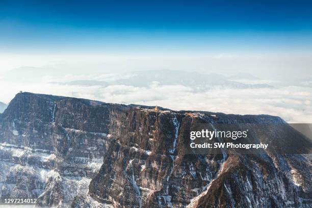 giant cliff of mt emei gold summit - emei shan stock pictures, royalty-free photos & images