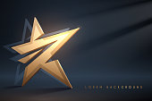 Golden star on dark background with light effect