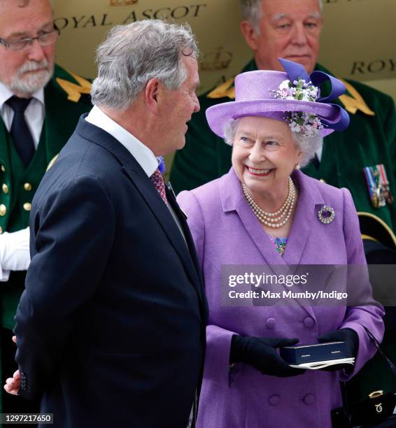 Trainer Sir Michael Stoute accompanies Queen Elizabeth II to the prize giving after her horse 'Estimate' won the Ascot Gold Cup on day 3 'Ladies Day'...