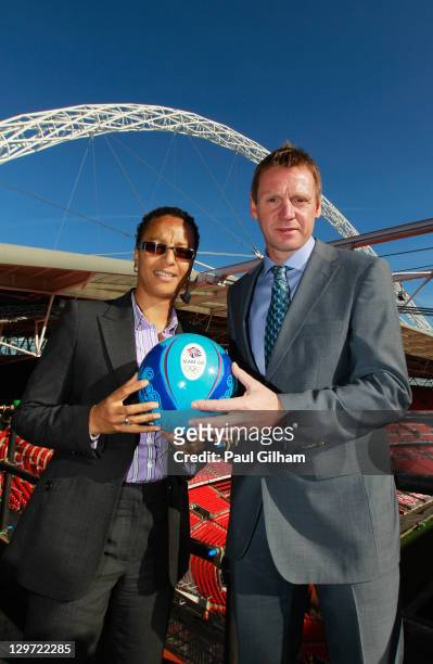 Hope Powell and Stuart Pearce pose together following a press conference to announce the Men's and Women's Football Team managers of Great Britain...