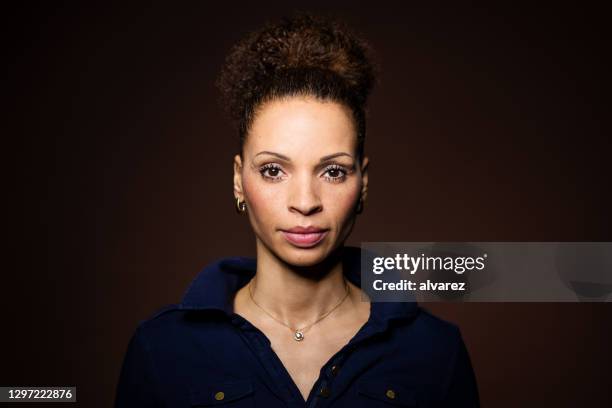 portrait of a confident mid adult woman - african american woman serious stock pictures, royalty-free photos & images