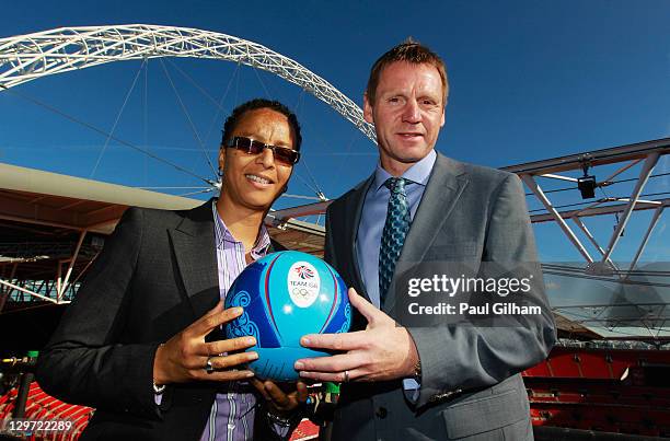 Hope Powell and Stuart Pearce pose together following a press conference to announce the Men's and Women's Football Team managers of Great Britain...