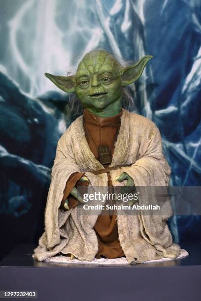 Puppet of iconic character, Yoda sits at a display showcase at The Star Wars Identities exhibition at The ArtScience Museum on January 19, 2021 in...