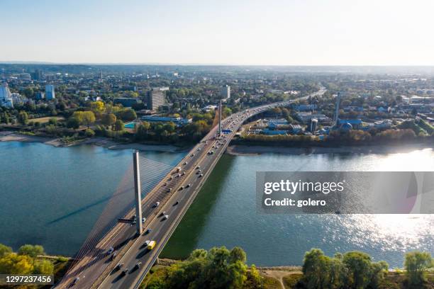 rush hour traffic on modern brige over rhine river - bonn stock pictures, royalty-free photos & images