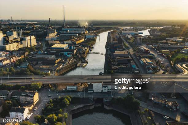 wide panoramic view over duisburg skyline at sunset - duisburg stock pictures, royalty-free photos & images