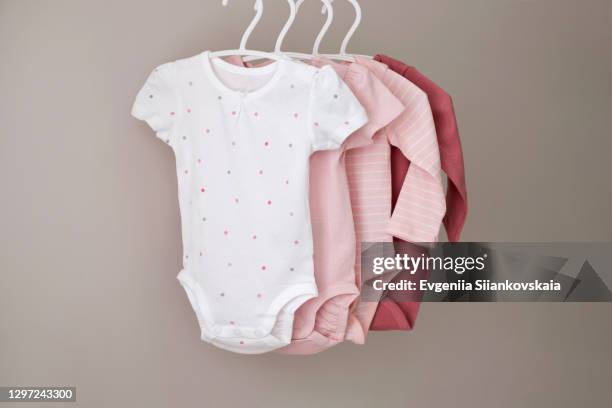 set of children bodysuits pastel colored. - babybekleidung stock-fotos und bilder