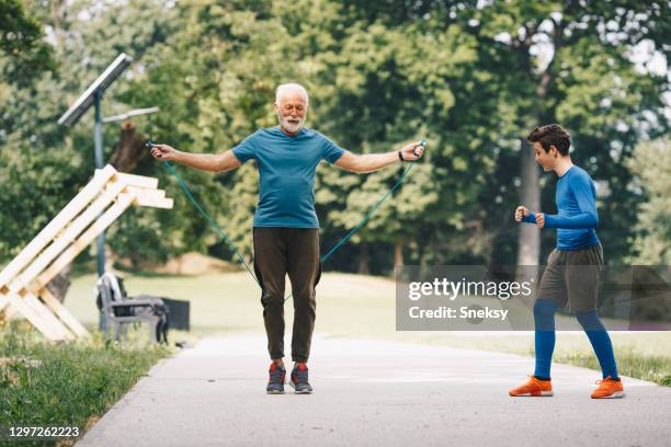 working out, jumping rope. - old trying to look young stock pictures, royalty-free photos & images