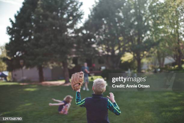 boy ready to catch a baseball - backyard baseball stock-fotos und bilder