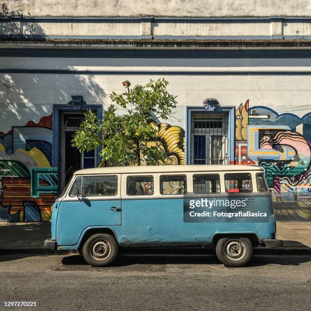 vintage vw transporter parked in the street - vw van stock pictures, royalty-free photos & images