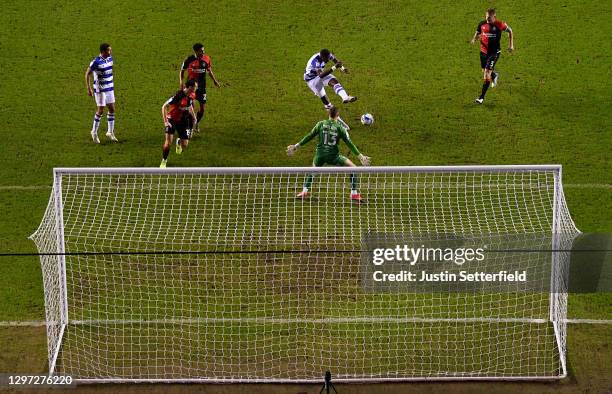 Lucas Joao of Reading scores their sides first goal past Ben Wilson of Coventry City during the Sky Bet Championship match between Reading and...