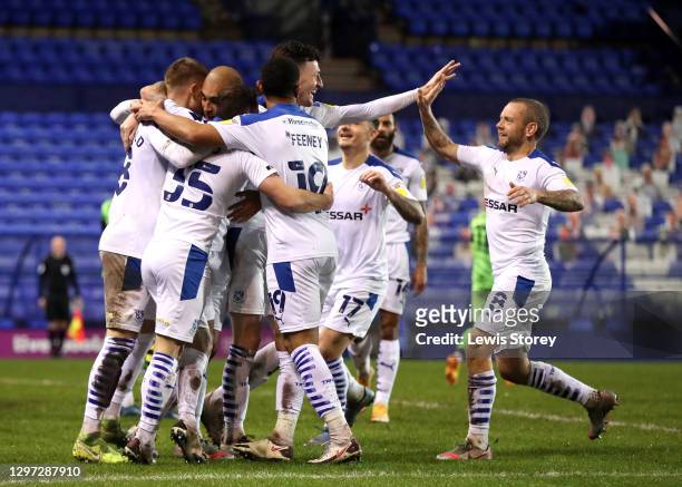 James Vaughan of Tranmere Rovers celebrates with Danny Lloyd, Liam Feeney and Jay Spearing after scoring his team's second goal during the Sky Bet...