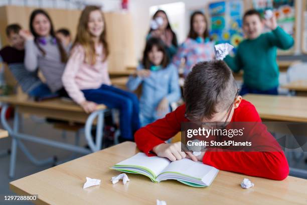 boy being bullied at school - assédio imagens e fotografias de stock