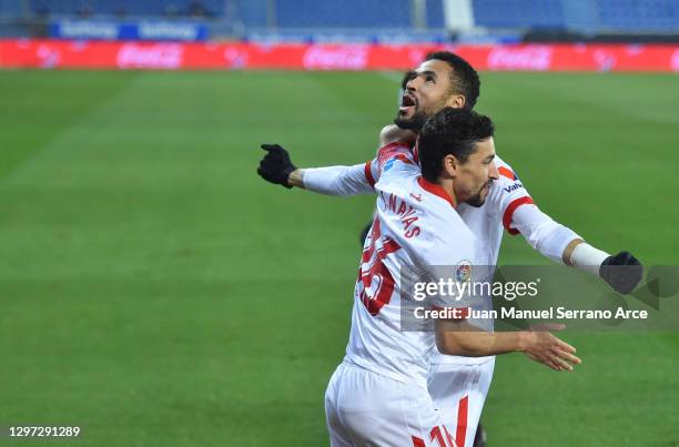 Youssef En-Nesyri of Sevilla celebrates with team mate Jesus Navas after scoring their side's first goal during the La Liga Santander match between...