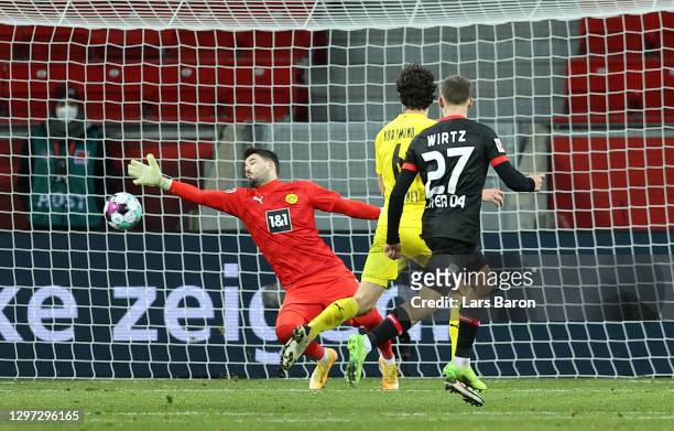 Florian Wirtz of Bayern 04 Leverkusen scores their sides second goal past Roman Burki of Borussia Dortmund during the Bundesliga match between Bayer...