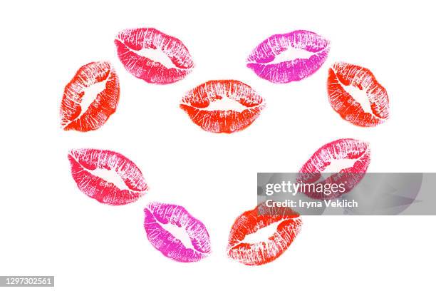 heart pattern made from lipstick kiss on white background. - lipstick heart stock pictures, royalty-free photos & images