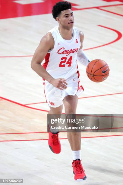 Quentin Grimes of the Houston Cougars in action against the Tulane Green Wave during a game at Fertitta Center on January 09, 2021 in Houston, Texas.