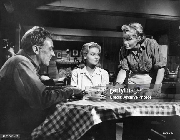 Arthur Kennedy, Diane McBain, and Constance Ford at the dinner table in a scene from the film 'Claudelle Inglish', 1961.