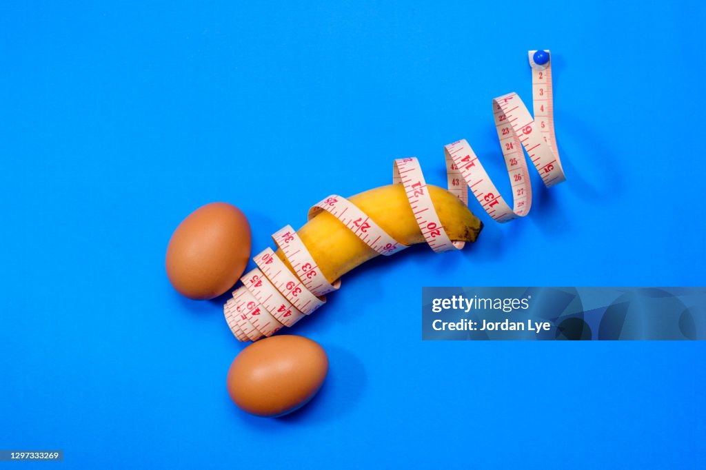 Egg and banana with measuring tape