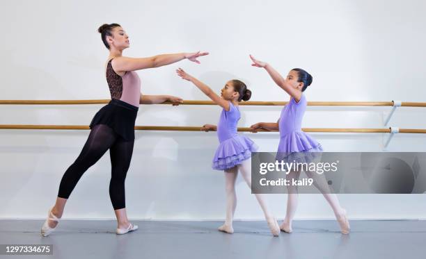 hispanic dance instructor with students in ballet class - child standing stock pictures, royalty-free photos & images