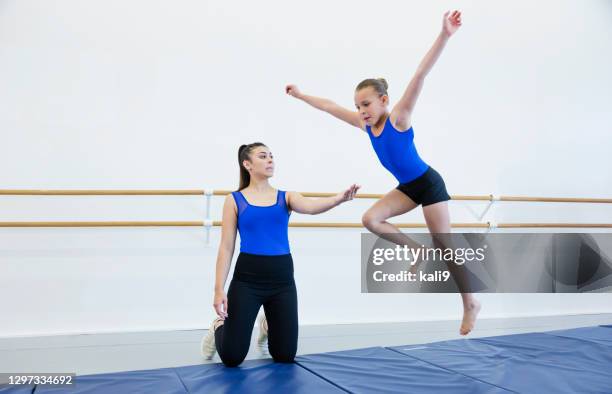 gymnast and coach practicing tumbling - somersault stock pictures, royalty-free photos & images
