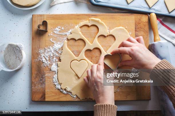 preparing heart sugar cookies. - pastry cutter bildbanksfoton och bilder
