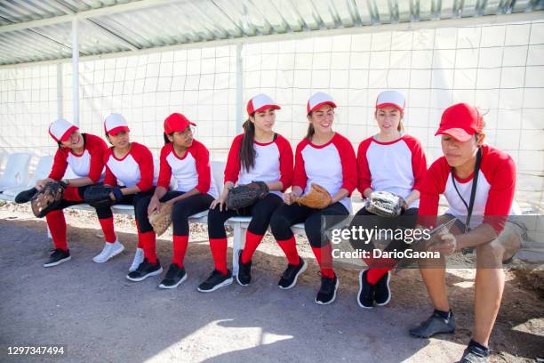 coach giving instructions on the bench - baseball team stock pictures, royalty-free photos & images