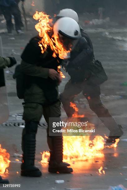 Police officer is engulfed in flames during a protest against plans for new austerity measures on October 20, 2011 in Athens, Greece. On the second...