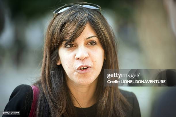 Famous Tunisian blogger Lina Ben Mhenni is seen on Bourguiba avenue in tunis on October 20 days before a historic national election in Tunisia. Arab...