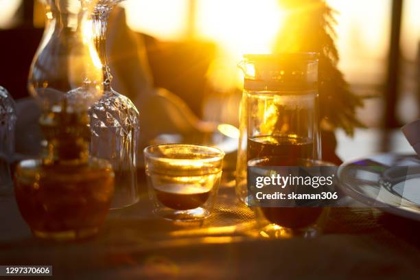 close up tea glass with black tea against the sun light in early morning and relaxation mood - steeping stock pictures, royalty-free photos & images