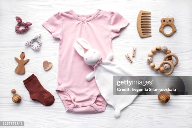 newborn baby clothing, socks, wooden toys, teether and accessories on white background. - kids in undies stock pictures, royalty-free photos & images