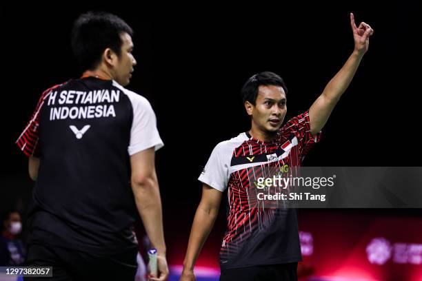 Hendra Setiawan and Mohammad Ahsan of Indonesia compete in the Men's Doubles first round match against Marcus Ellis and Chris Langridge of England on...