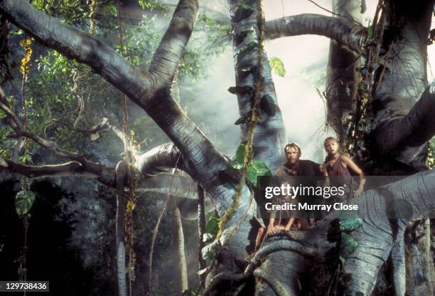 Actor Sam Neill as Dr. Alan Grant, with Ariana Richards and Joseph Mazzello as Lex and Tim, in a scene from the film 'Jurassic Park', 1993.