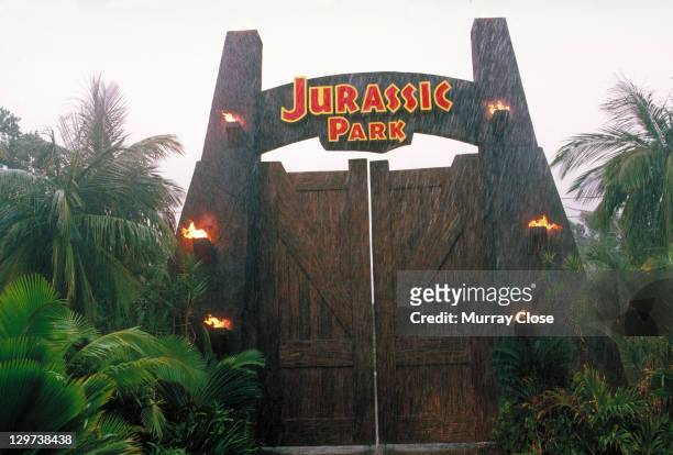 The gateway to the eponymous theme park, from the film 'Jurassic Park', 1993.