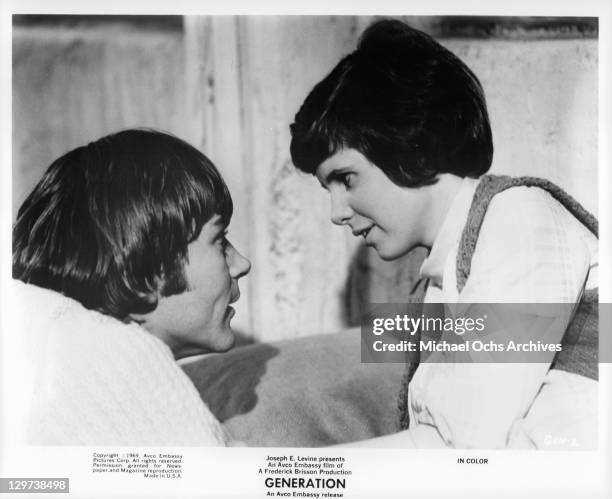 Pete Duel and Kim Darby gazing into one anothers eyes in a scene from the film 'Generation', 1969.