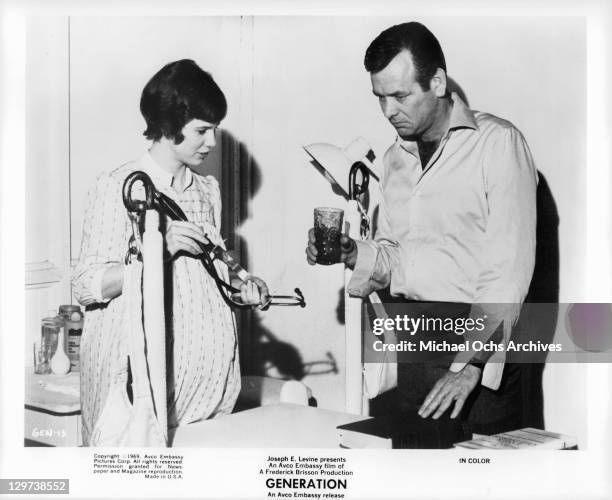 Kim Darby holding a stethoscope while talking with David Janssen in a scene from the film 'Generation', 1969.