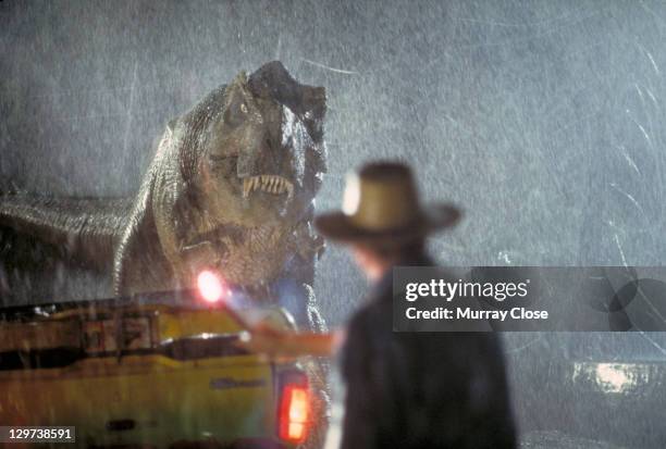 Actor Sam Neill as Dr. Alan Grant takes on a Tyrannosaurus Rex in a scene from the film 'Jurassic Park', 1993.