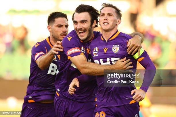 Neil Kilkenny of the Glory celebrates a gaol from the a penalty with Nick D'Agostino and Bruno Fornaroli during the A-League match between the Perth...
